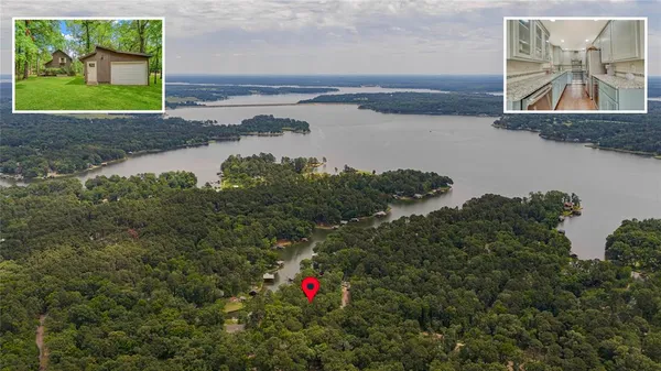 a picture of lake with a yard