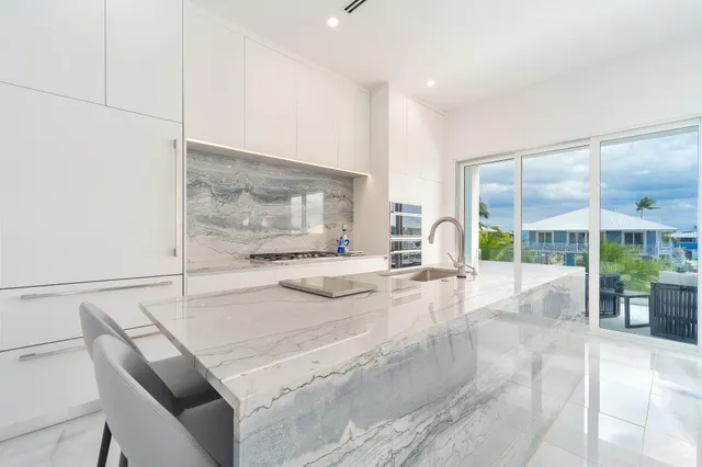 a bedroom with a large bed and a large window