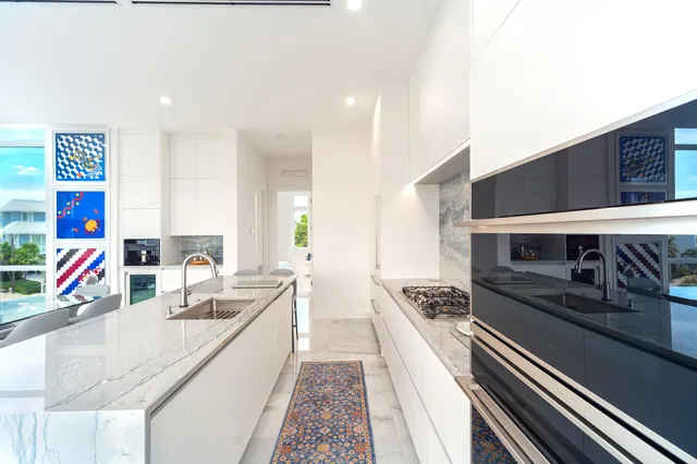 a spacious bedroom with a bed and a painting on the wall