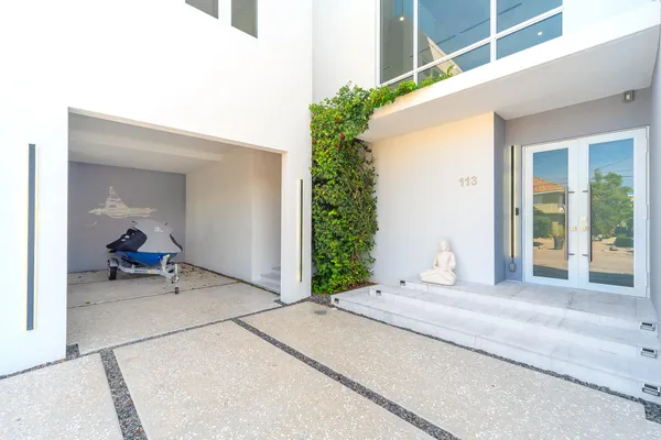 a view of swimming pool with a lounge chairs