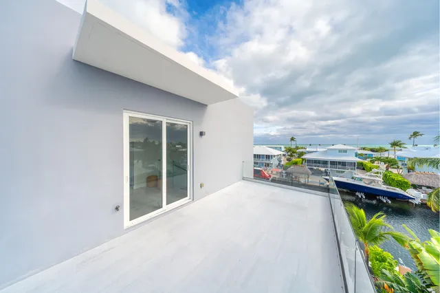 a bedroom with a bed and a desk