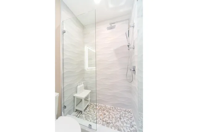 a room with pool table and large windows