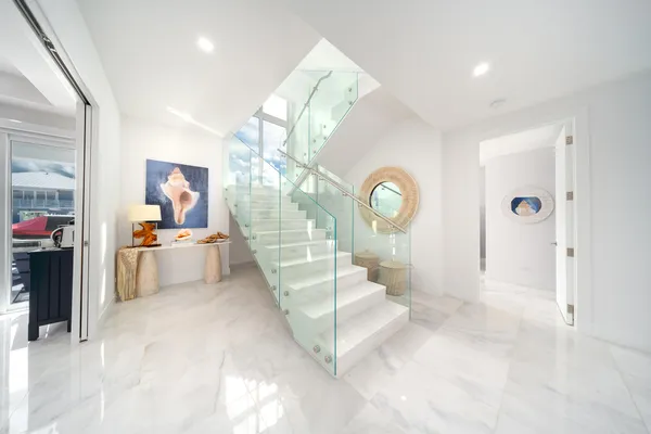 an aerial view of residential houses with outdoor space and swimming pool