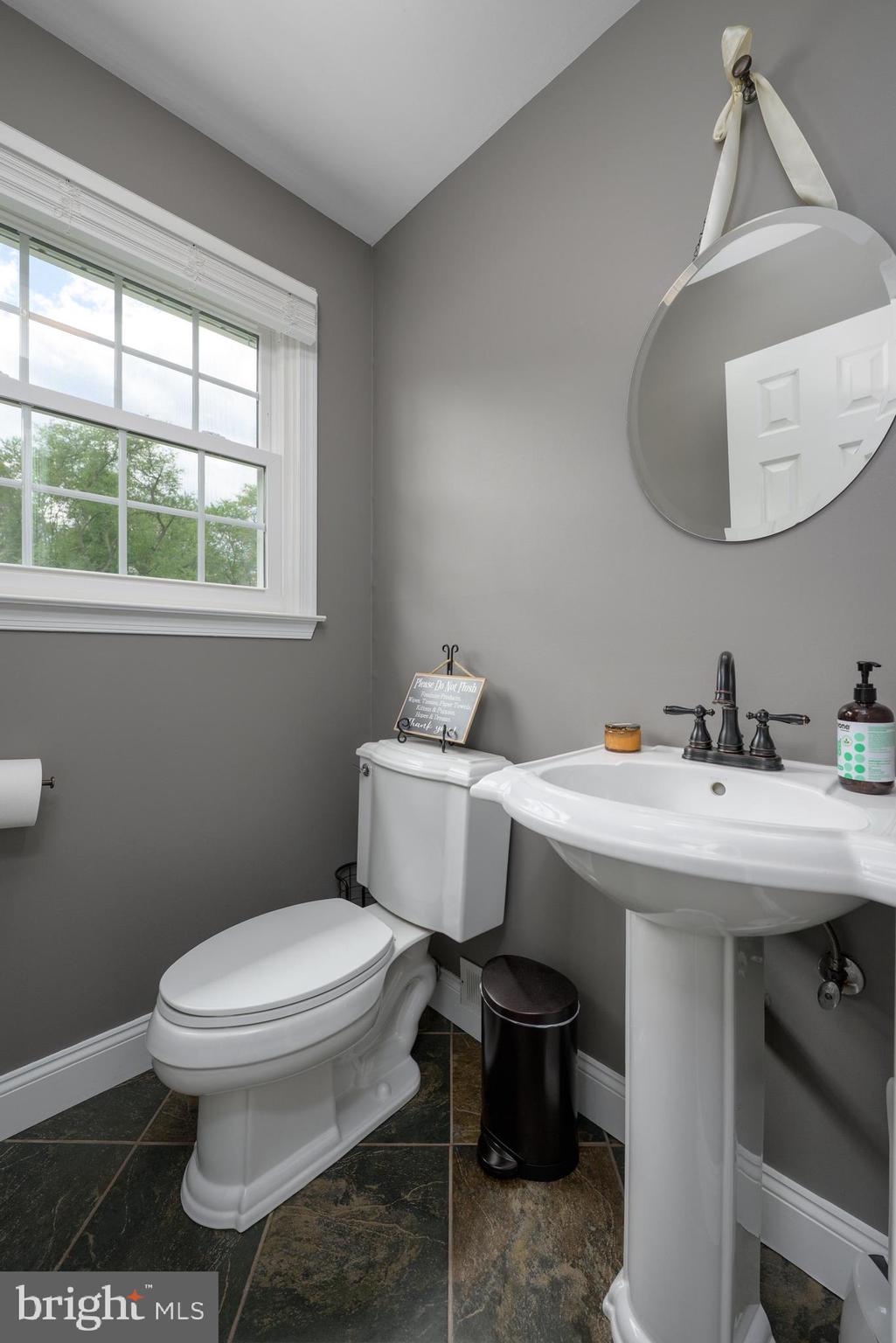 47 Millstone Drive Shamong, NJ 08088 - Photo 15 of 32 a bathroom with a sink a toilet and a mirror