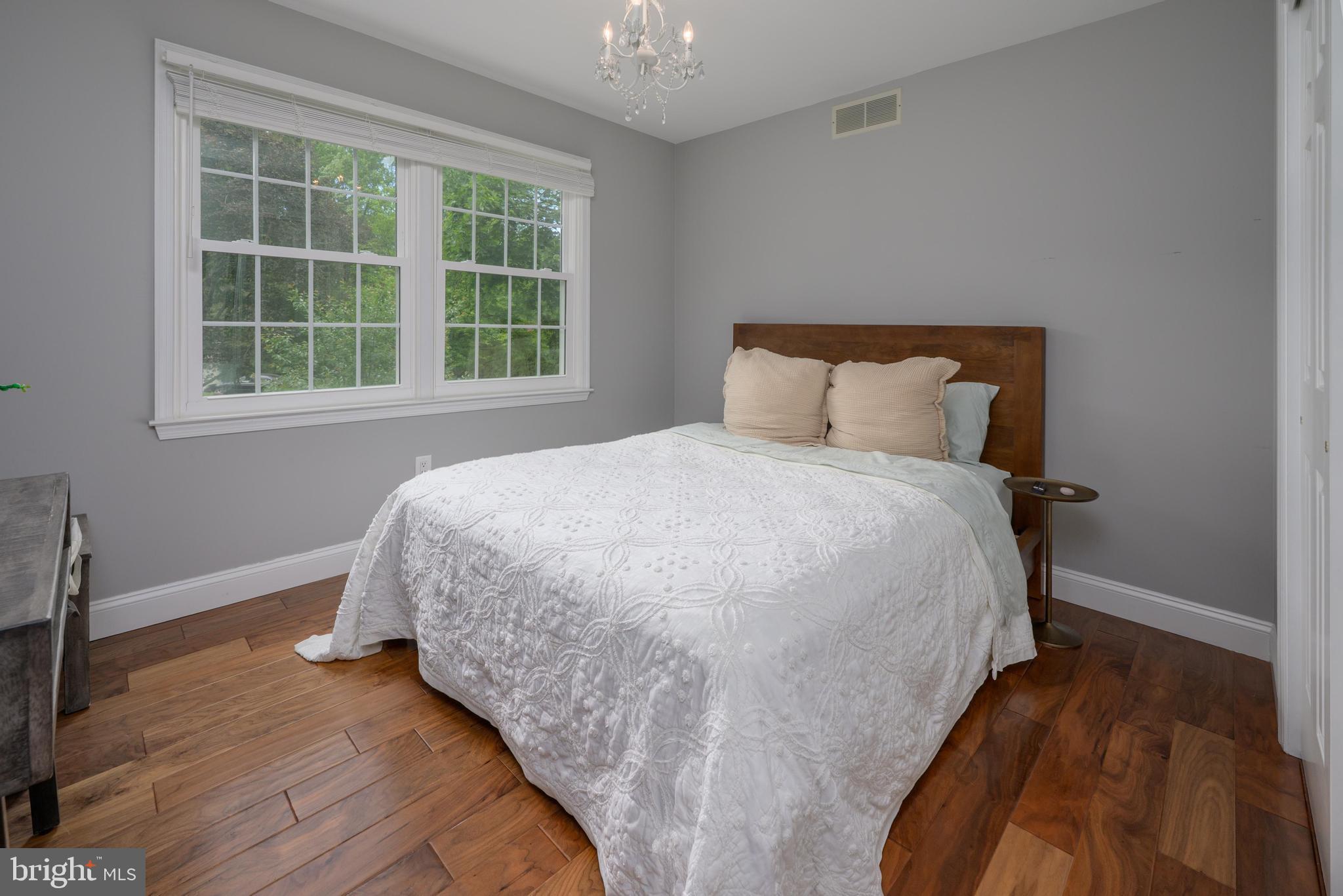 47 Millstone Drive Shamong, NJ 08088 - Photo 20 of 32 a bed sitting in a bedroom next to a window