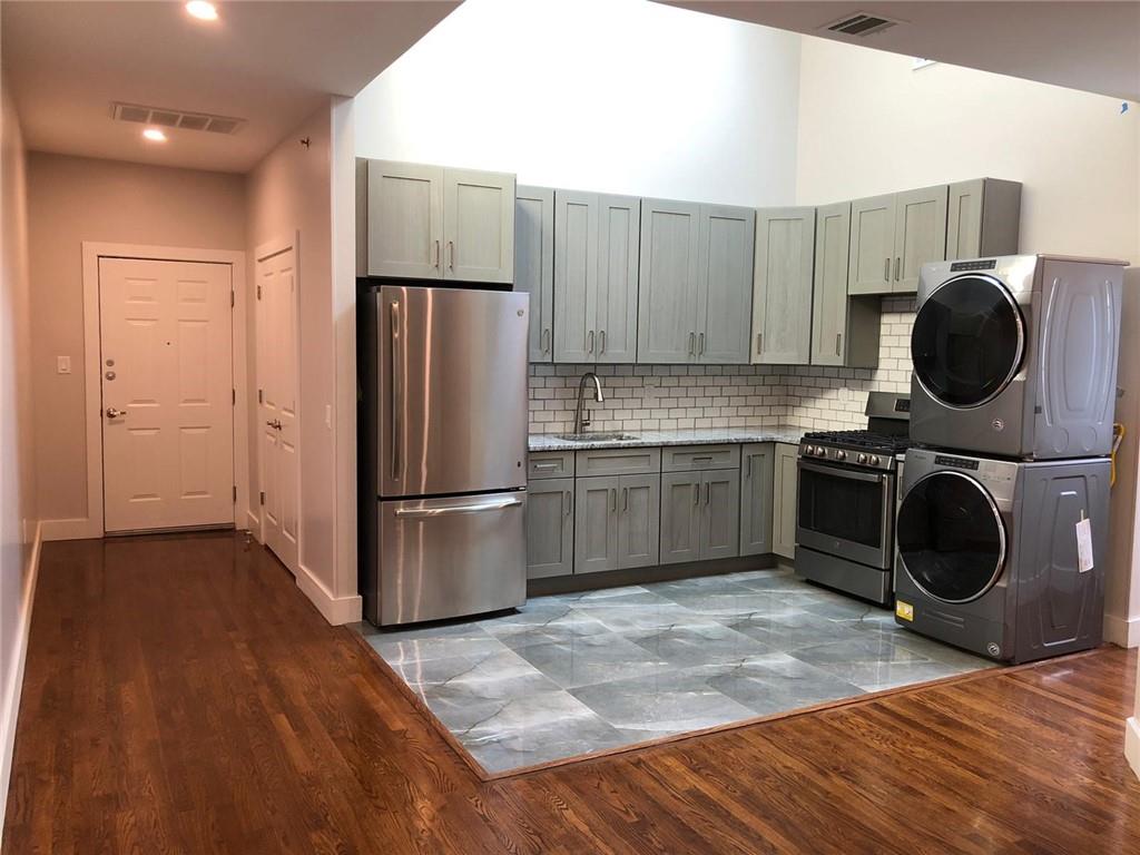 15 South Main Street, Unit B Spring Valley, NY 10977 - Photo 1 of 1 a kitchen with a refrigerator sink and cabinets