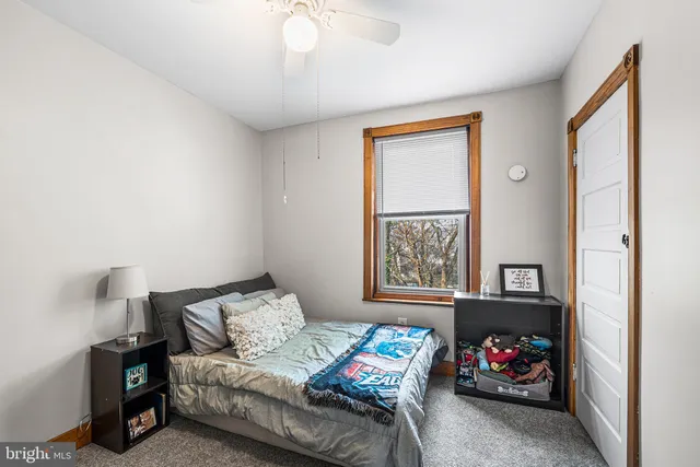 a bedroom with furniture and a window