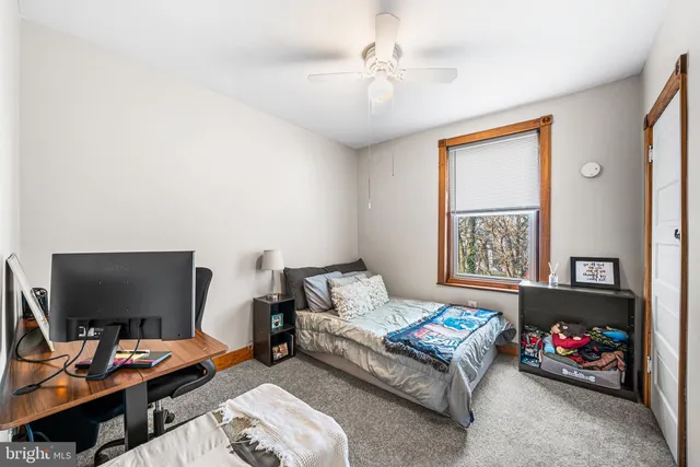 a bedroom with furniture and a window