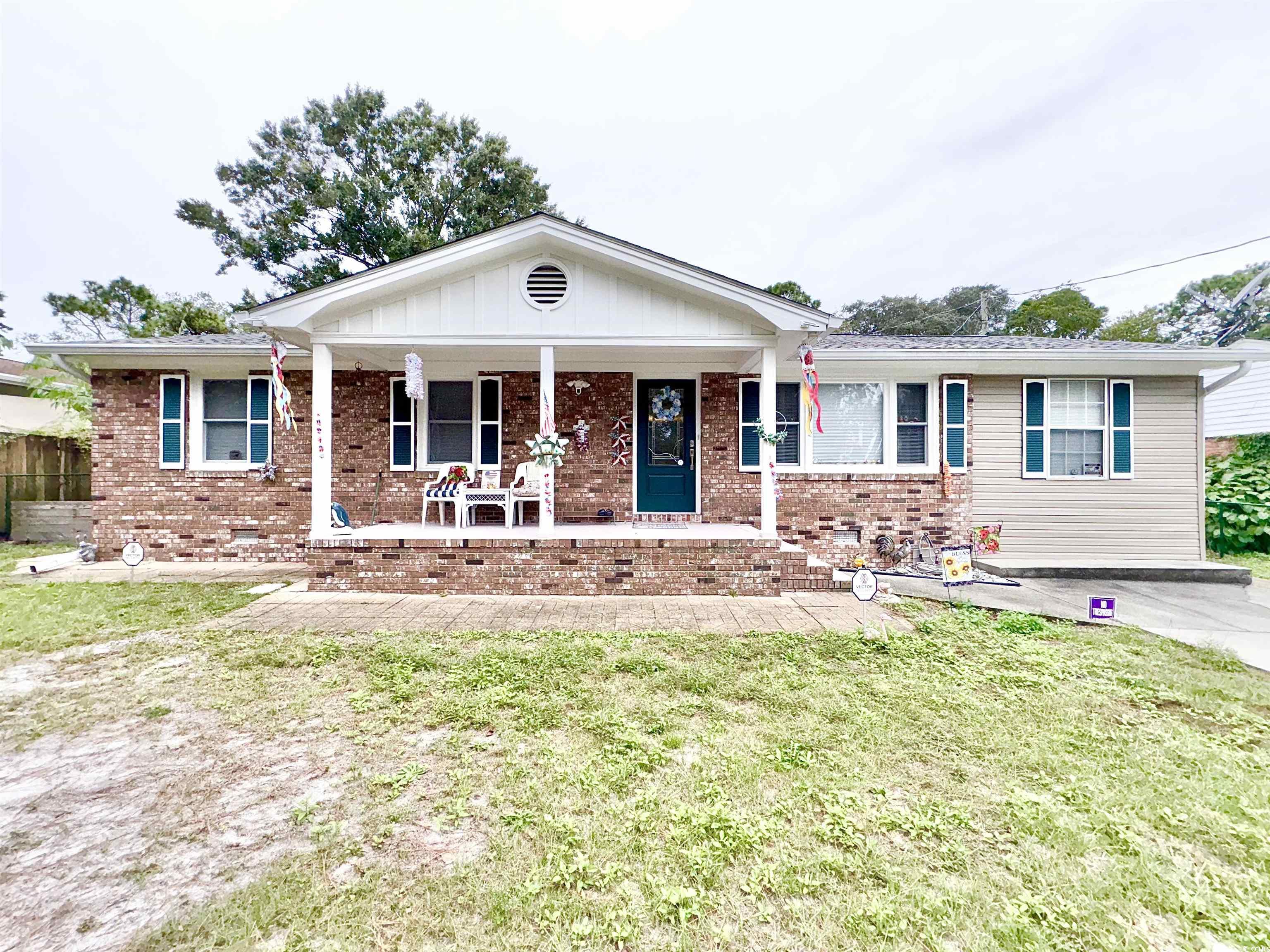 View of front of property featuring covered porch
