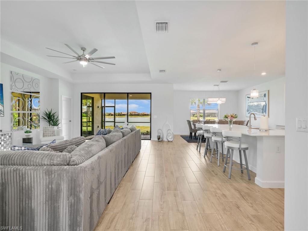 18278 Ridgeline Drive Estero, FL 33928 - Photo 5 of 45 a living room with furniture and a large window