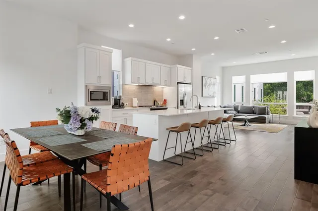 a kitchen with counter top space a sink cabinets and appliances