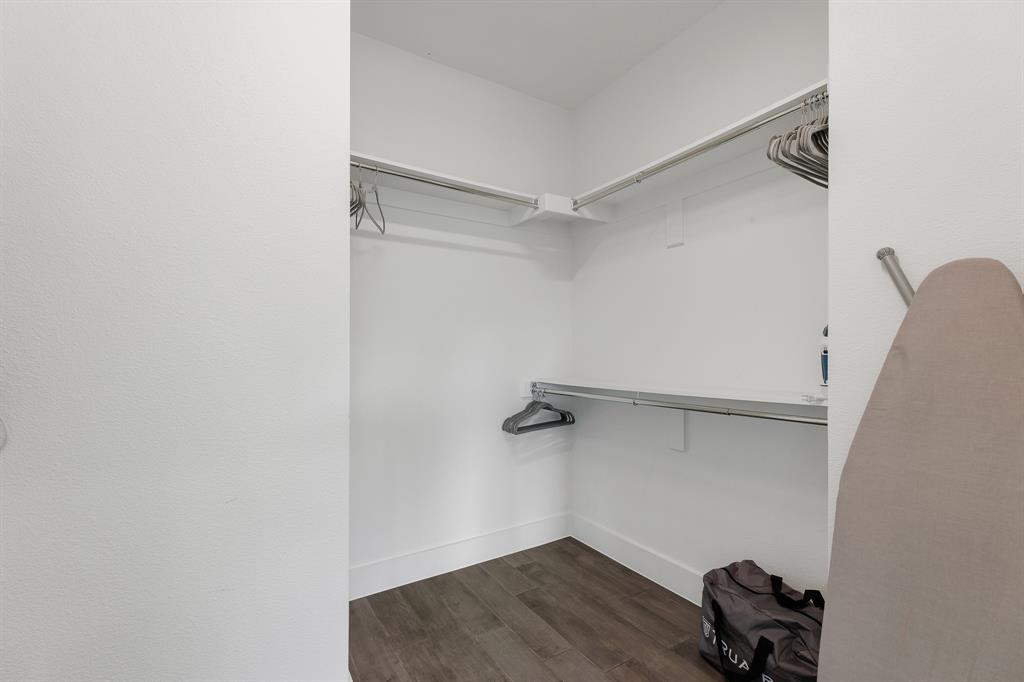 1771 Mccoy Street, Unit 401 Dallas, TX 75204 - Photo 15 of 30 Spacious closet with dark wood-style flooring