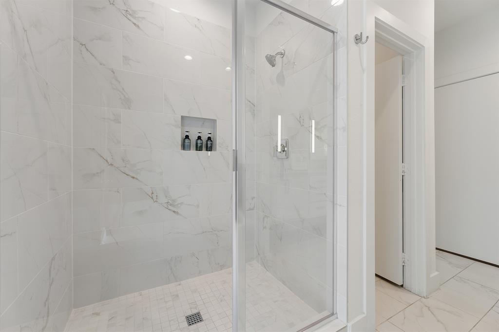 1771 Mccoy Street, Unit 401 Dallas, TX 75204 - Photo 17 of 30 Bathroom featuring a marble finish shower and marble finish flooring