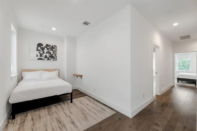 a white bath tub sitting next to a bathroom sink