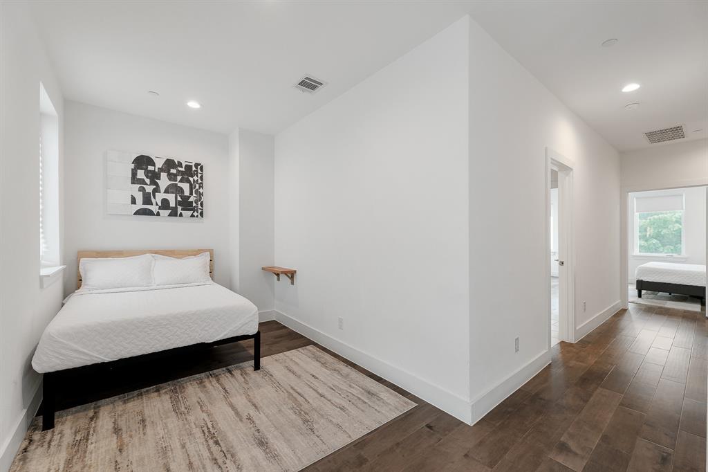 1771 Mccoy Street, Unit 401 Dallas, TX 75204 - Photo 19 of 30 Bedroom with wood finished floors and recessed lighting