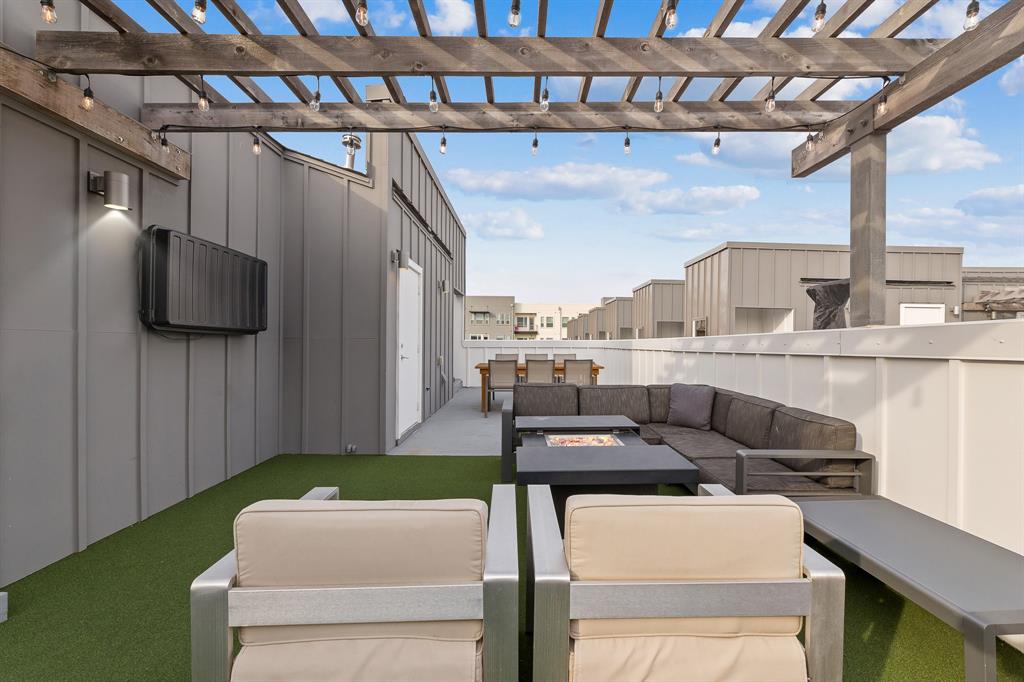1771 Mccoy Street, Unit 401 Dallas, TX 75204 - Photo 22 of 30 View of patio featuring an outdoor living space with a fire pit and a pergola