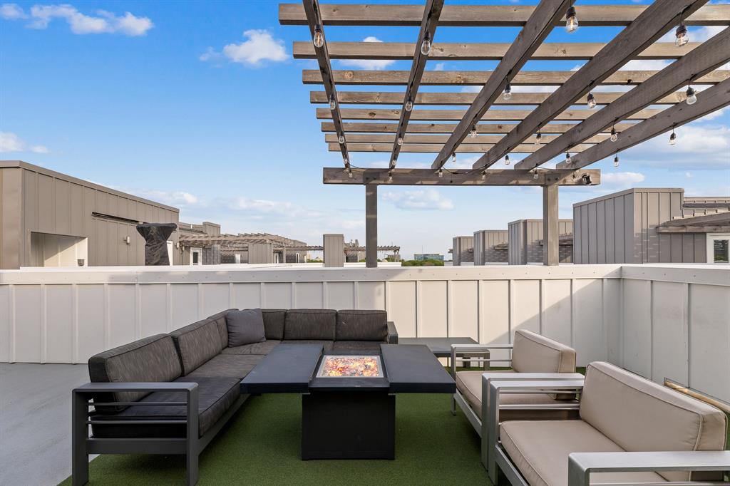 1771 Mccoy Street, Unit 401 Dallas, TX 75204 - Photo 23 of 30 View of patio featuring an outdoor living space with a fire pit