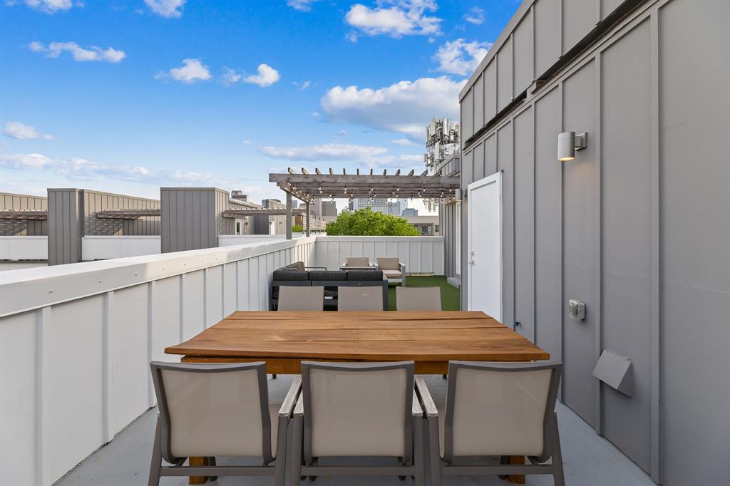 1771 Mccoy Street, Unit 401 Dallas, TX 75204 - Photo 24 of 30 Balcony featuring outdoor dining space and a pergola