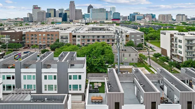 a balcony with table and chairs