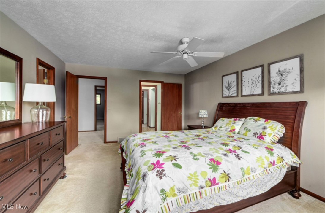 22536 Center Ridge Road, Unit A Rocky River, OH 44116 - Photo 22 of 32 Carpeted bedroom and ceiling fan