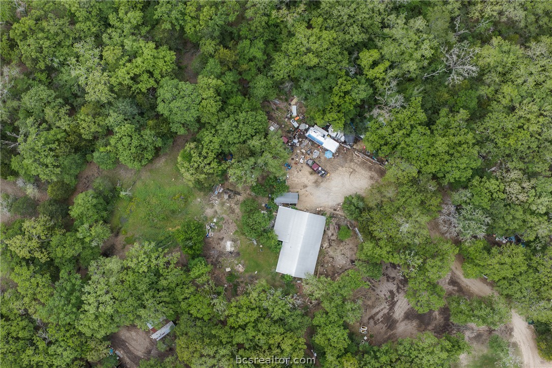 604 Hilton Road Bryan, TX 77807 - Photo 22 of 31 an aerial view of a house with a yard and trees