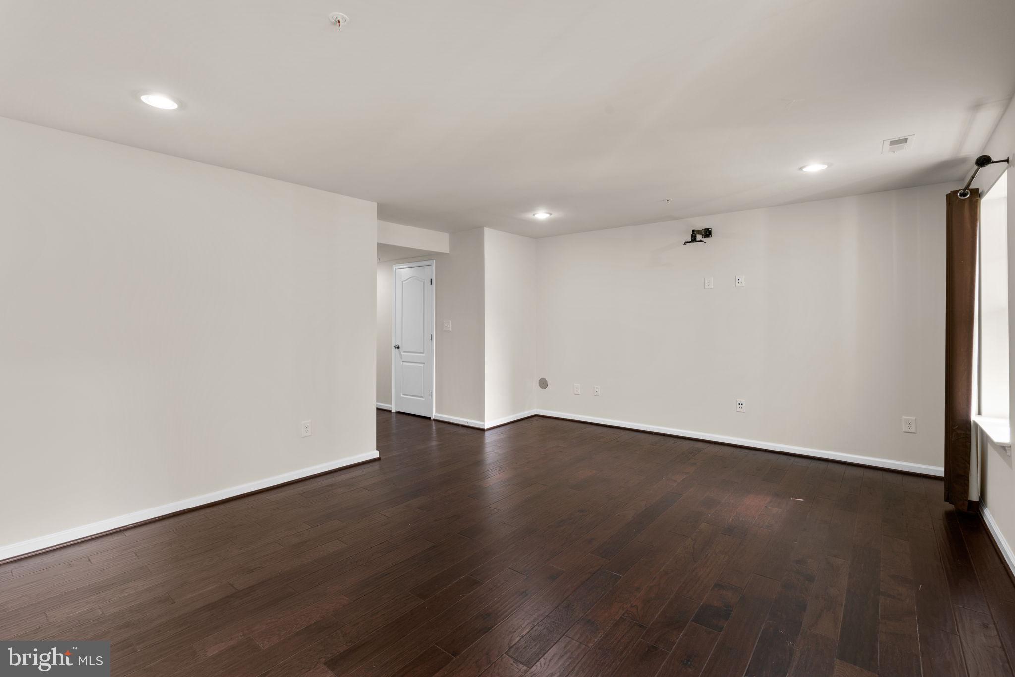 7977 Alchemy Way Elkridge, MD 21075 - Photo 23 of 33 an empty room with wooden floor