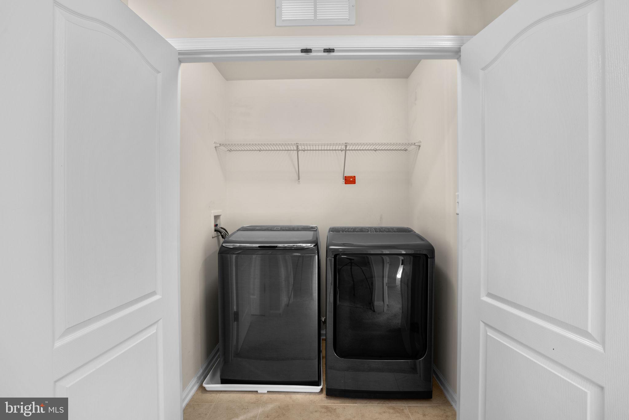 7977 Alchemy Way Elkridge, MD 21075 - Photo 27 of 33 a utility room with washer and dryer