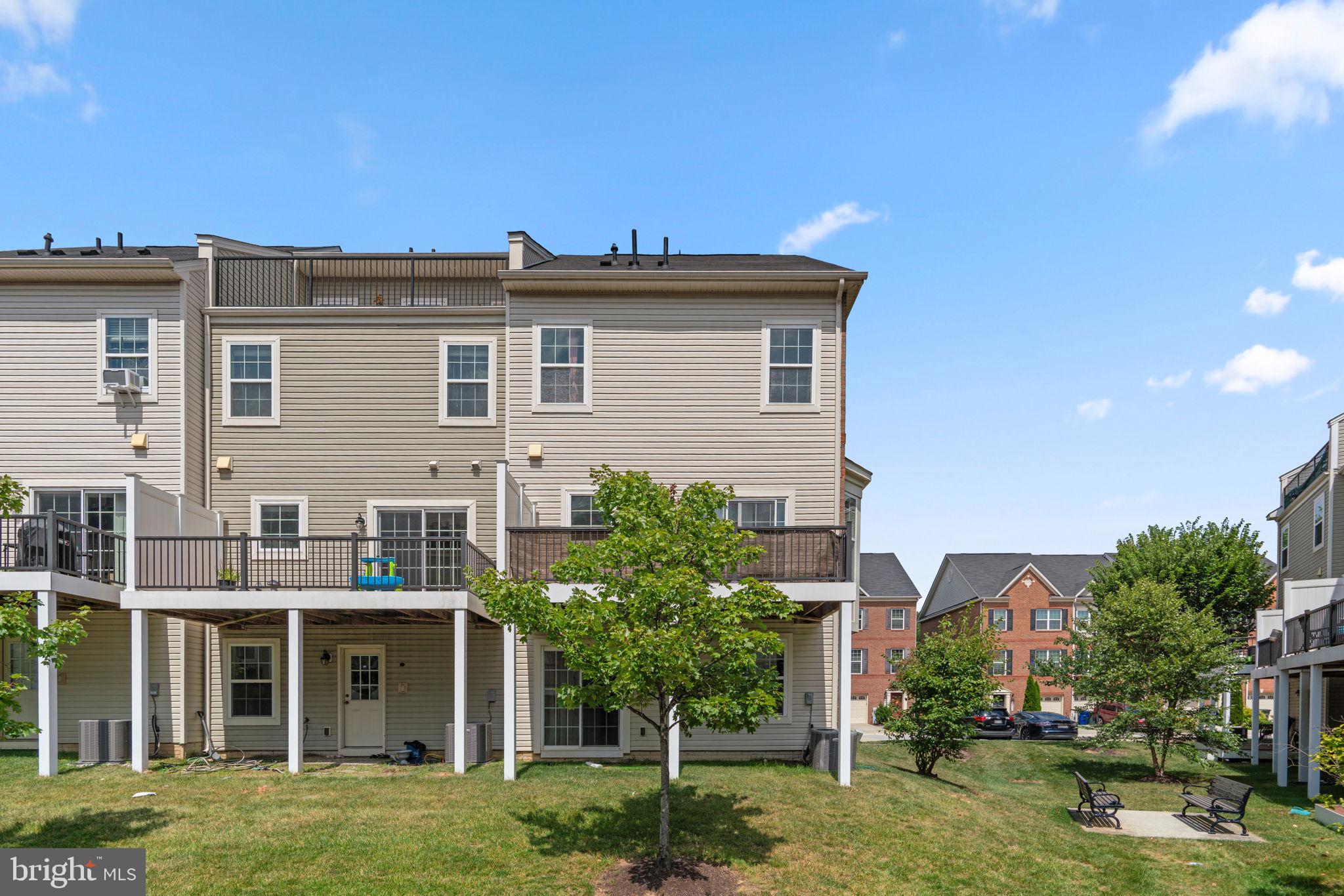 7977 Alchemy Way Elkridge, MD 21075 - Photo 29 of 33 a view of a house with a yard and plants