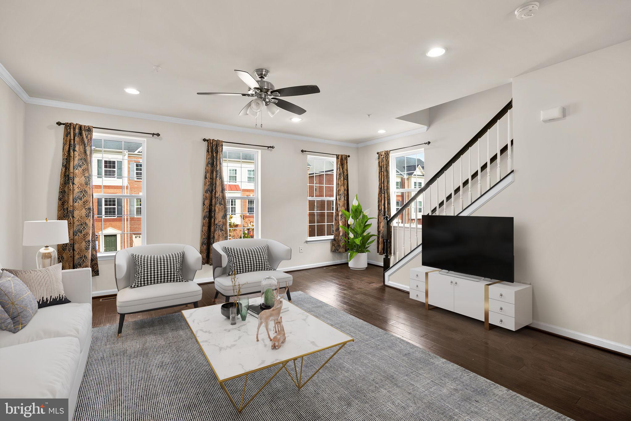 7977 Alchemy Way Elkridge, MD 21075 - Photo 3 of 33 a living room with furniture and a flat screen tv