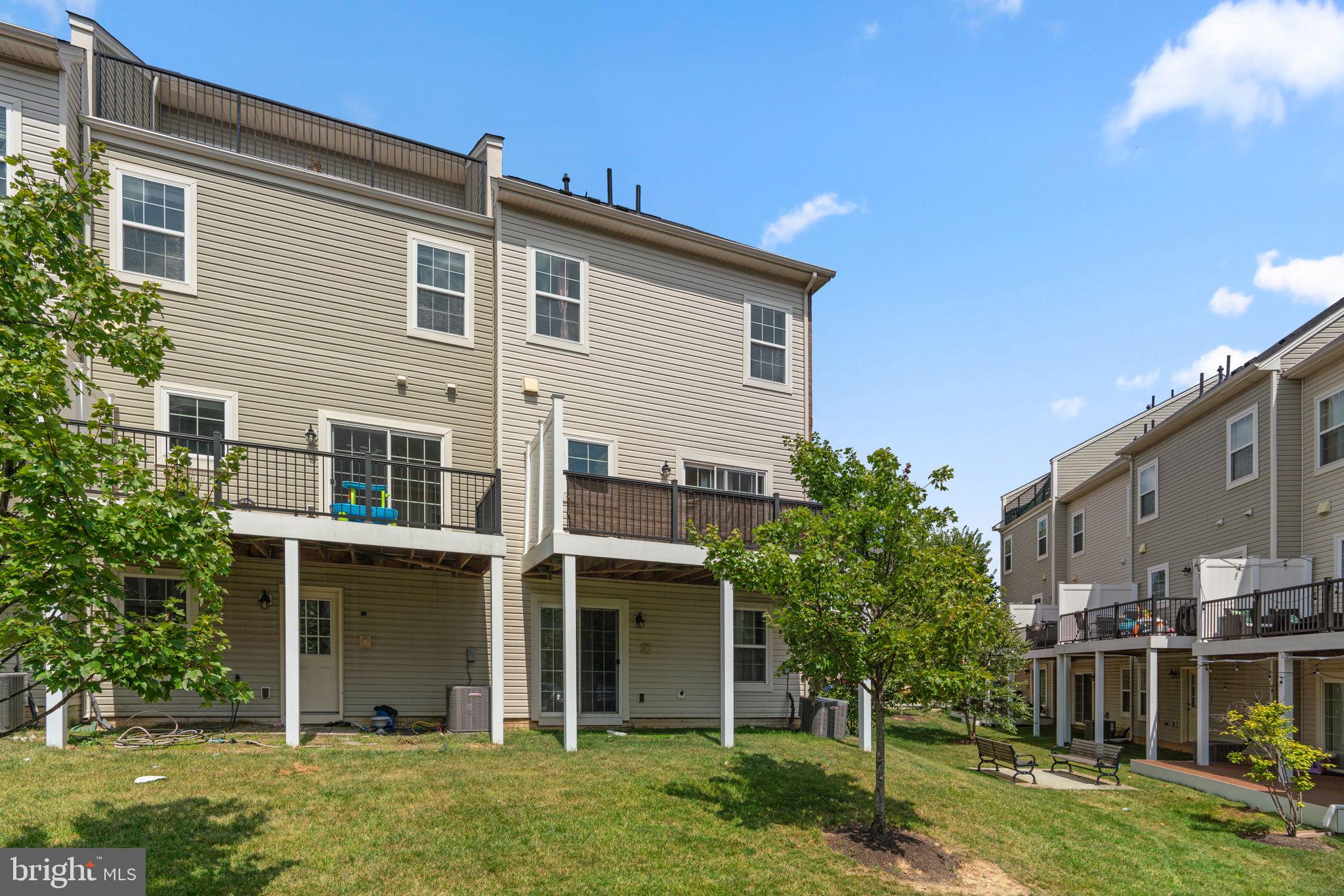 7977 Alchemy Way Elkridge, MD 21075 - Photo 31 of 33 a view of an house with backyard space and garden