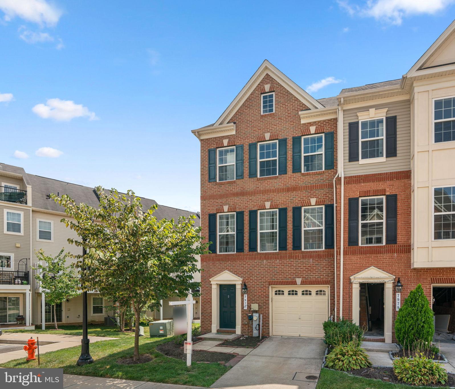 7977 Alchemy Way Elkridge, MD 21075 - Photo 32 of 33 a front view of a house with a yard