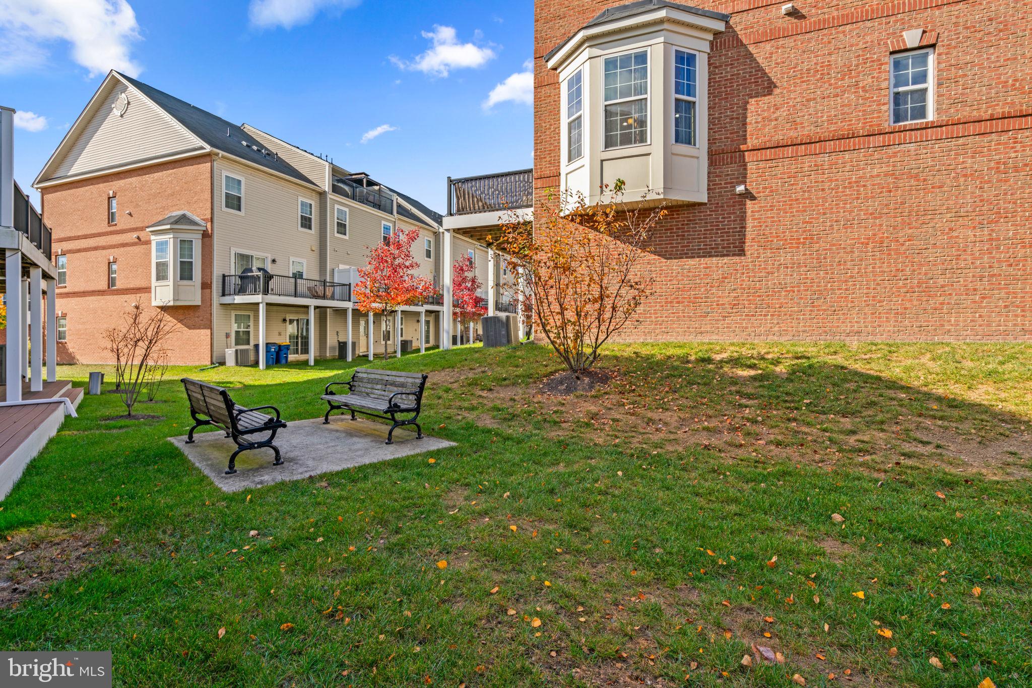 7977 Alchemy Way Elkridge, MD 21075 - Photo 33 of 33 a front view of a house with a yard