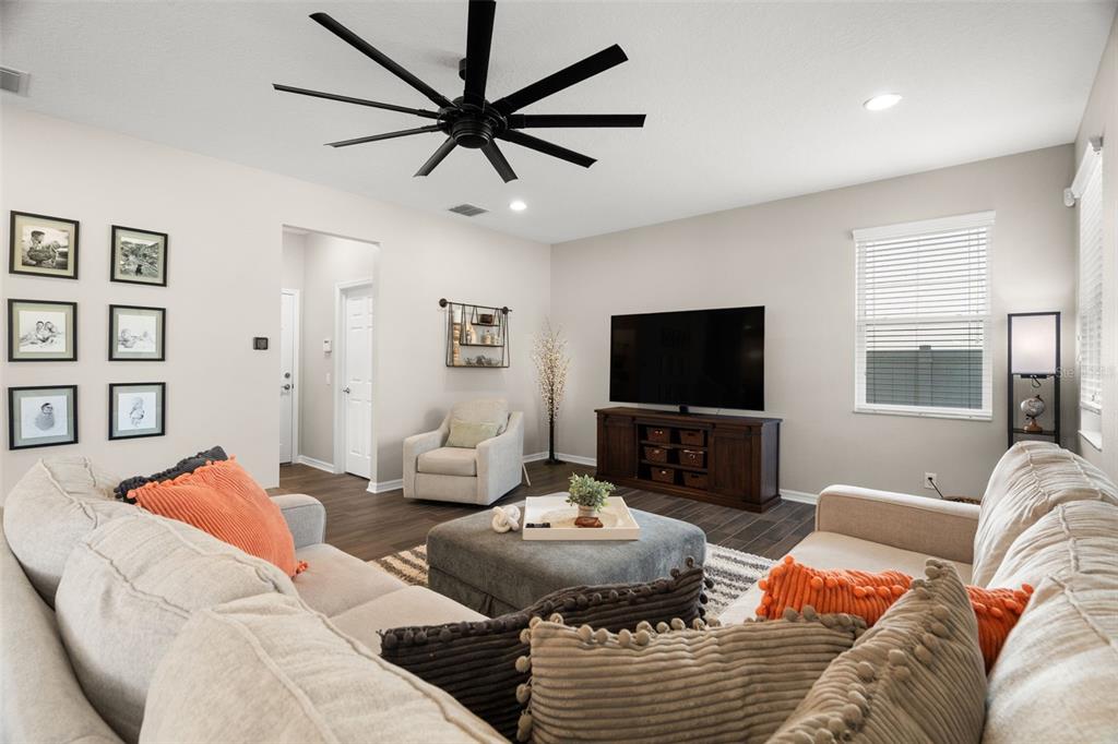 1216 Multiflora Loop Lutz, FL 33558 - Photo 14 of 50 a living room with furniture and a flat screen tv