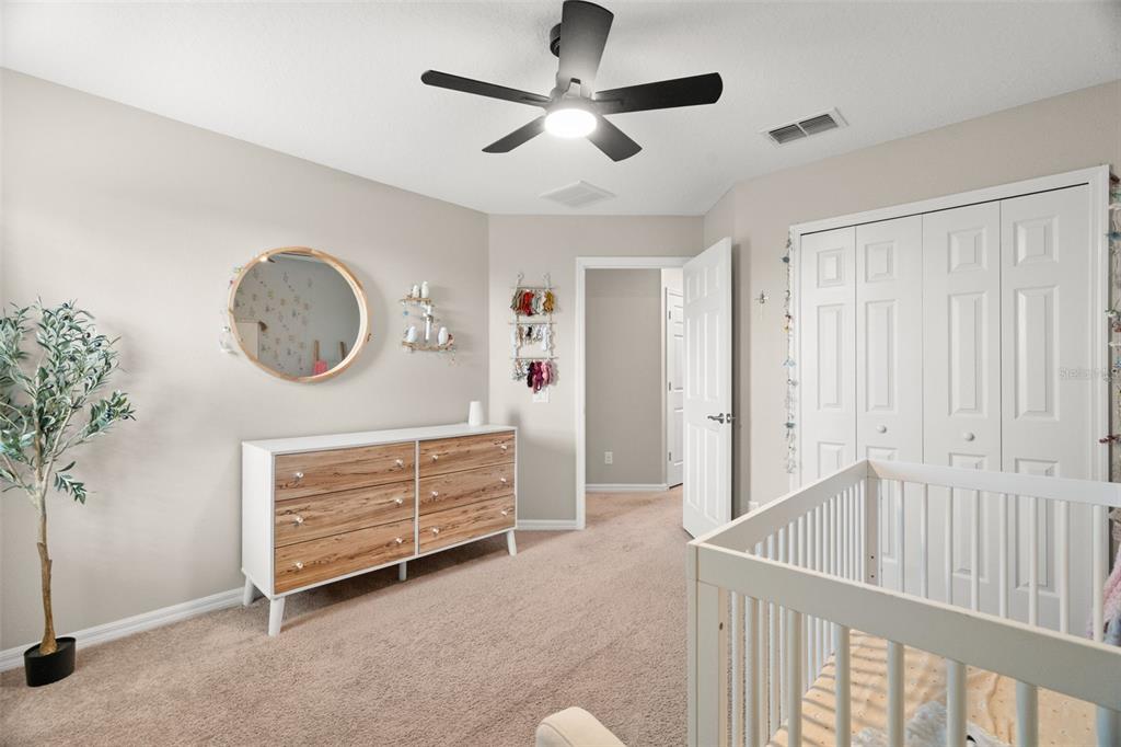 1216 Multiflora Loop Lutz, FL 33558 - Photo 22 of 50 a view of a hallway to a livingroom with furniture