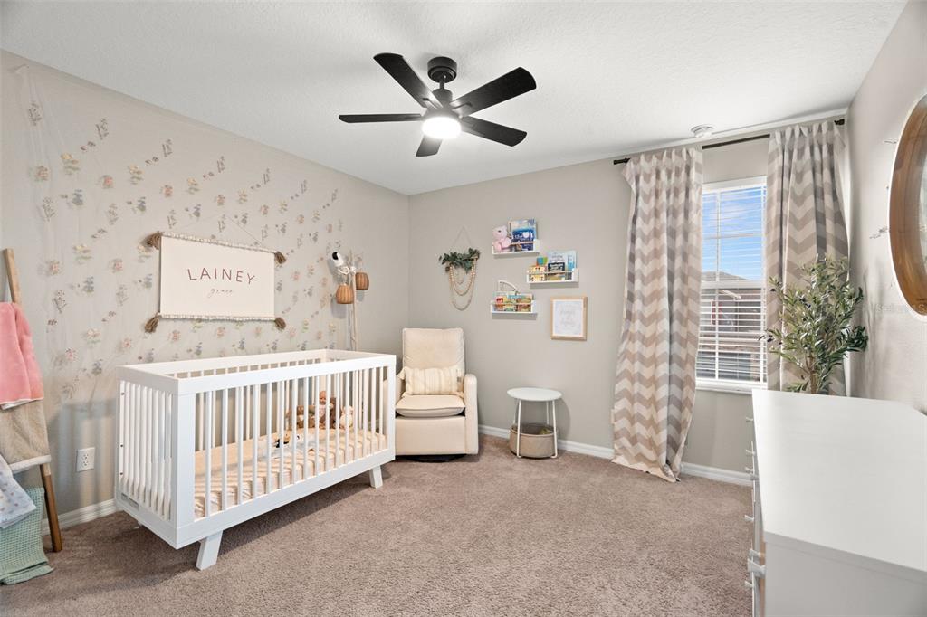 1216 Multiflora Loop Lutz, FL 33558 - Photo 23 of 50 a bedroom with a bed and a window