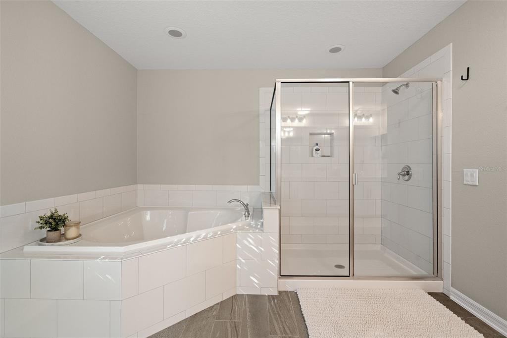 1216 Multiflora Loop Lutz, FL 33558 - Photo 37 of 50 a white bath tub sitting next to a shower