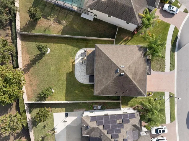 an aerial view of a house with a lake view