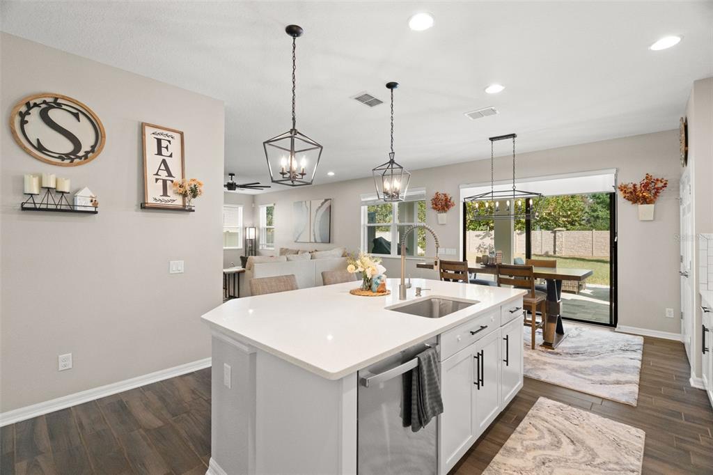 1216 Multiflora Loop Lutz, FL 33558 - Photo 6 of 50 a large white kitchen with a sink