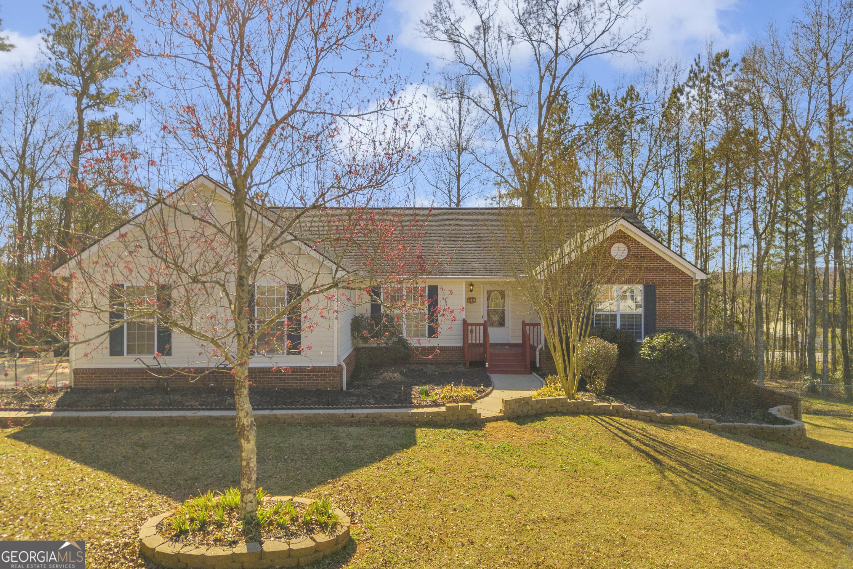 a view of a house with snow on the road