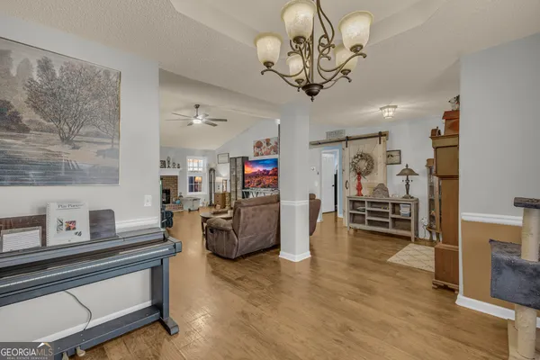 a view of walk in closet with clothes