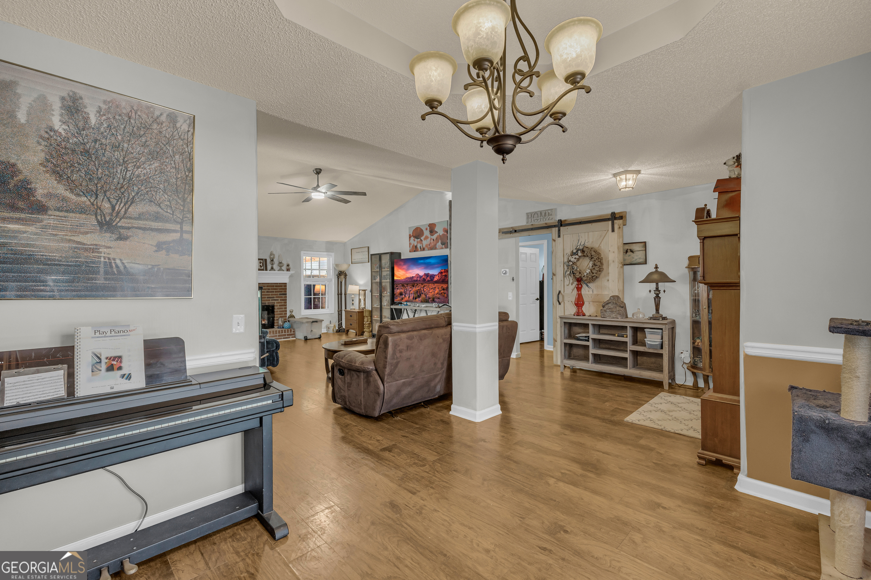 139 Silverstone Circle Jefferson, GA 30549 - Photo 33 of 85 a view of a livingroom with furniture and a chandelier