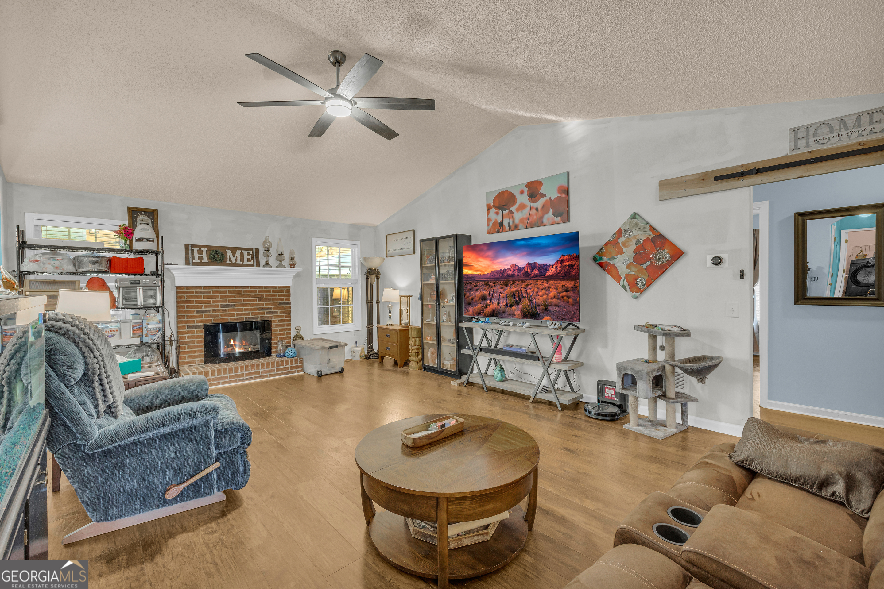139 Silverstone Circle Jefferson, GA 30549 - Photo 34 of 85 a living room with furniture and a fireplace
