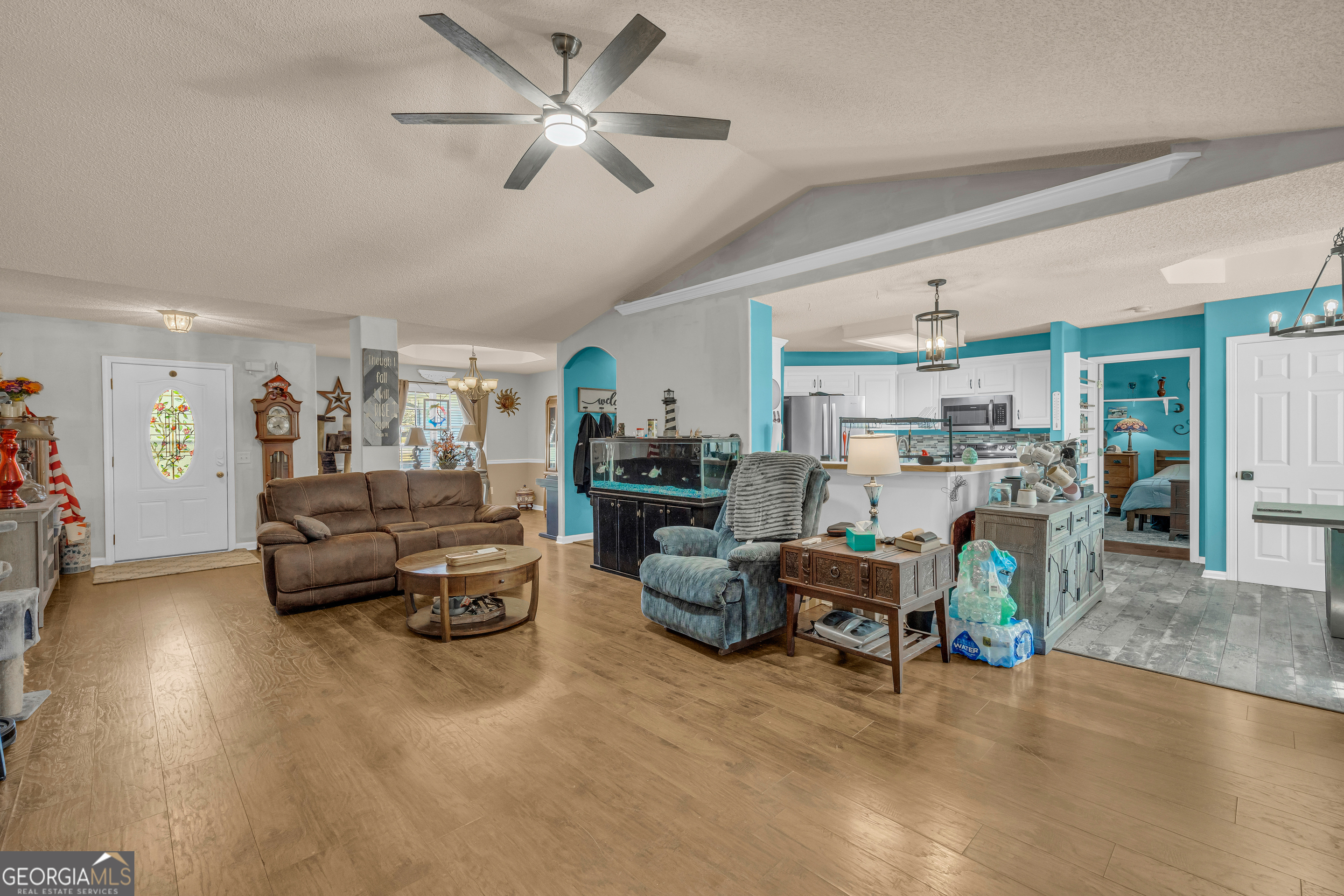 139 Silverstone Circle Jefferson, GA 30549 - Photo 36 of 85 a living room with furniture and a chandelier