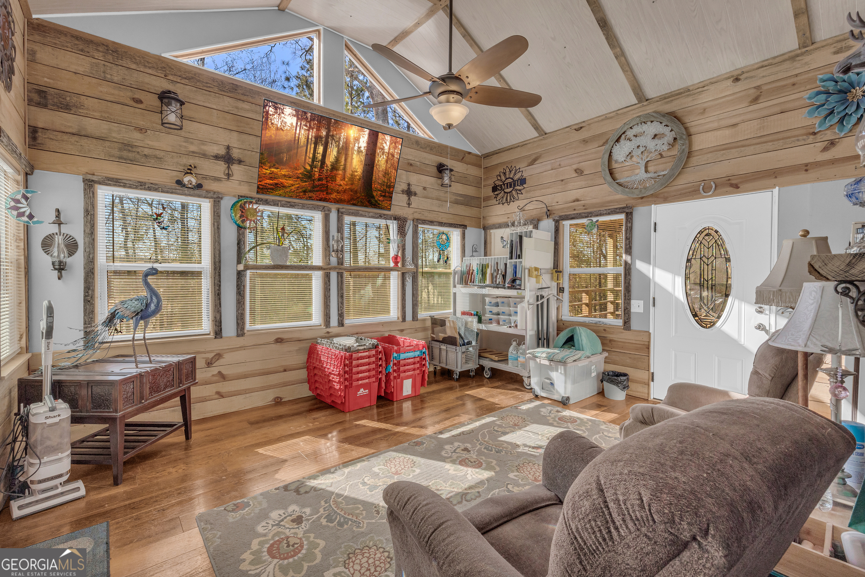 139 Silverstone Circle Jefferson, GA 30549 - Photo 41 of 85 a living room with furniture a clock and a large window