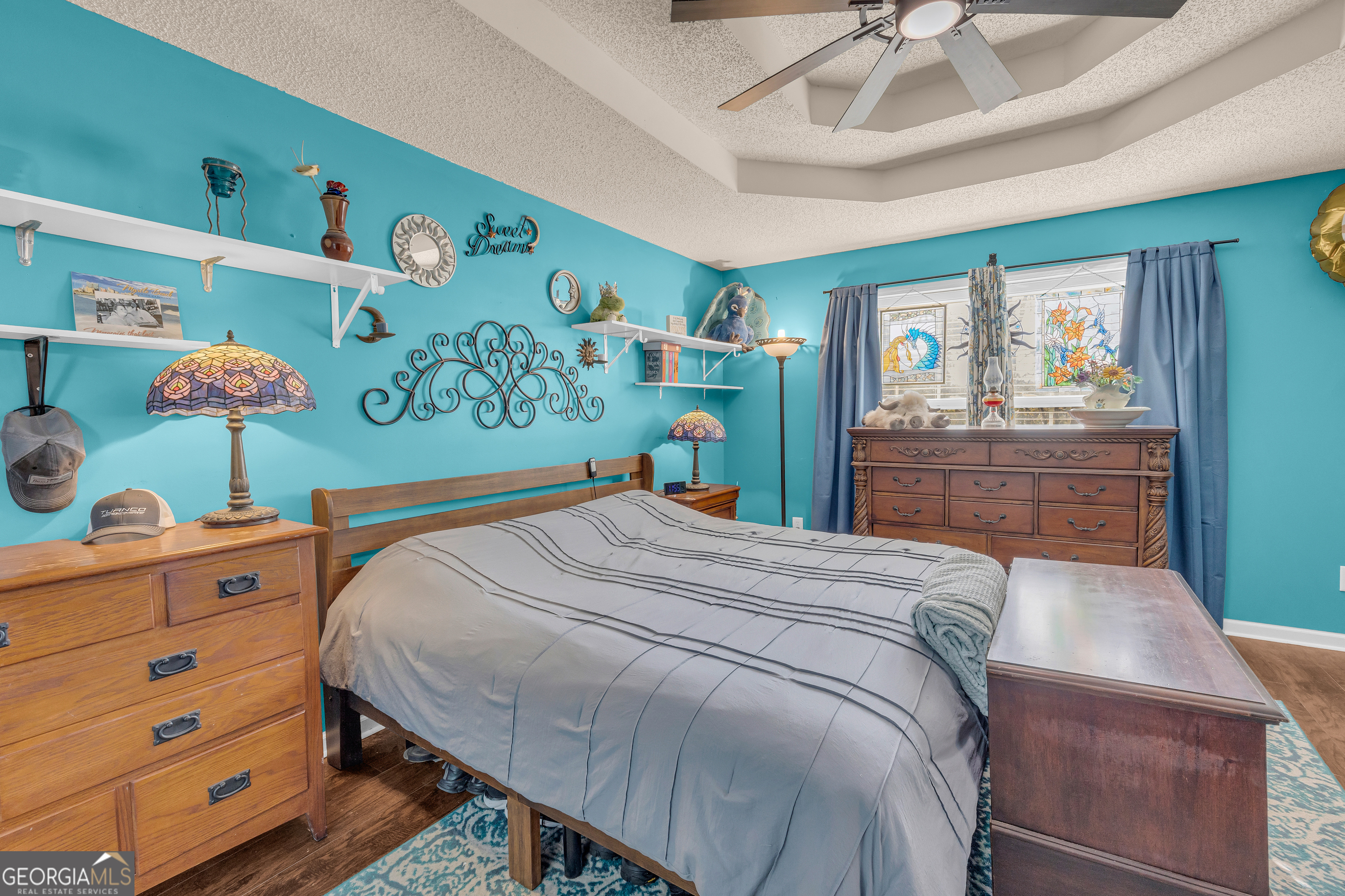 139 Silverstone Circle Jefferson, GA 30549 - Photo 48 of 85 a bedroom with a bed and a dresser in it