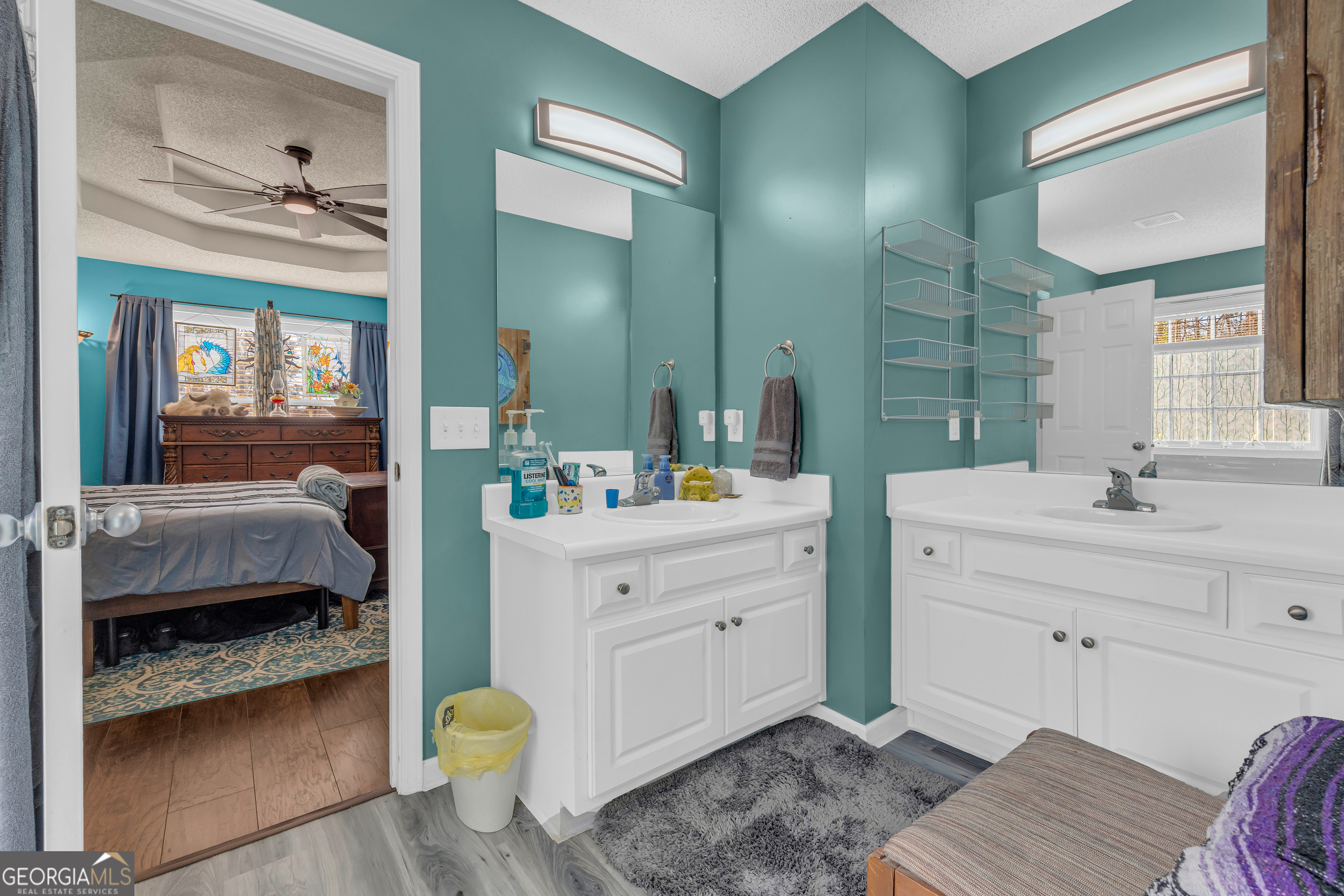 139 Silverstone Circle Jefferson, GA 30549 - Photo 53 of 85 a en suite bathroom with a granite countertop sink and a mirror