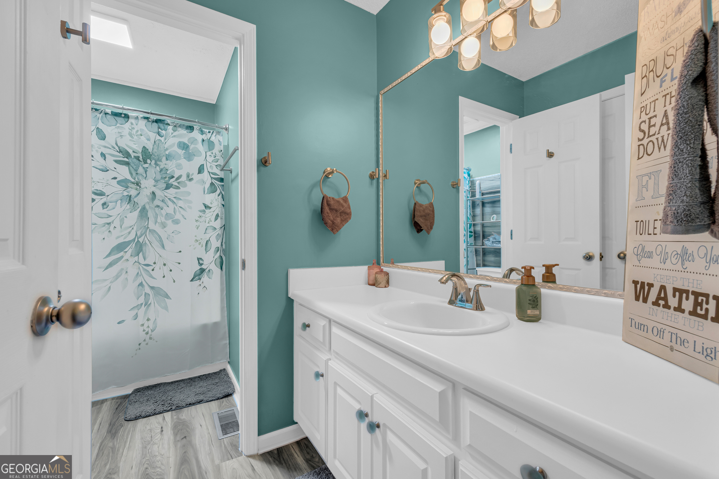 139 Silverstone Circle Jefferson, GA 30549 - Photo 58 of 85 a bathroom with a sink and a mirror