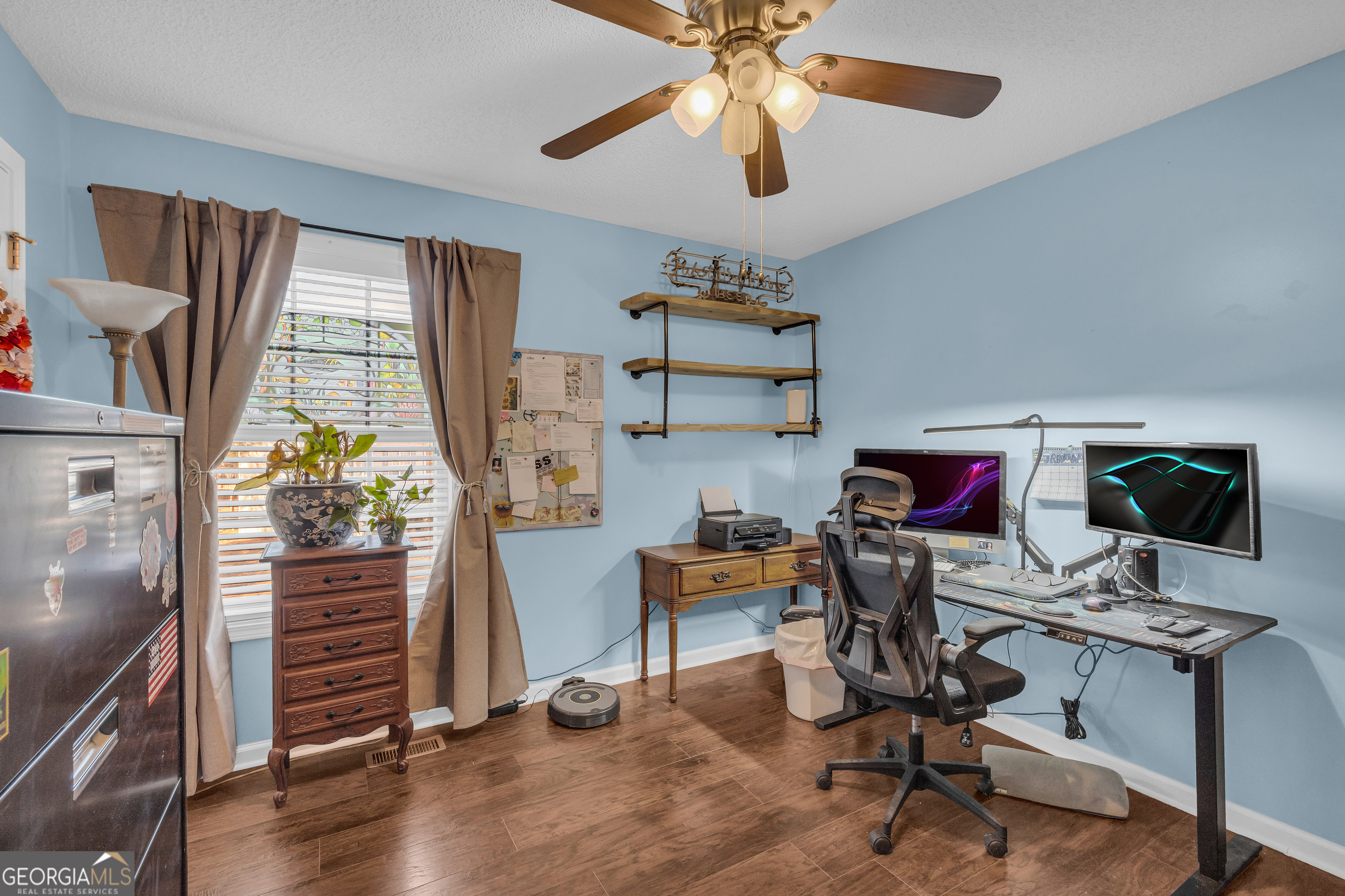 139 Silverstone Circle Jefferson, GA 30549 - Photo 62 of 85 a view of a workspace with furniture and a window