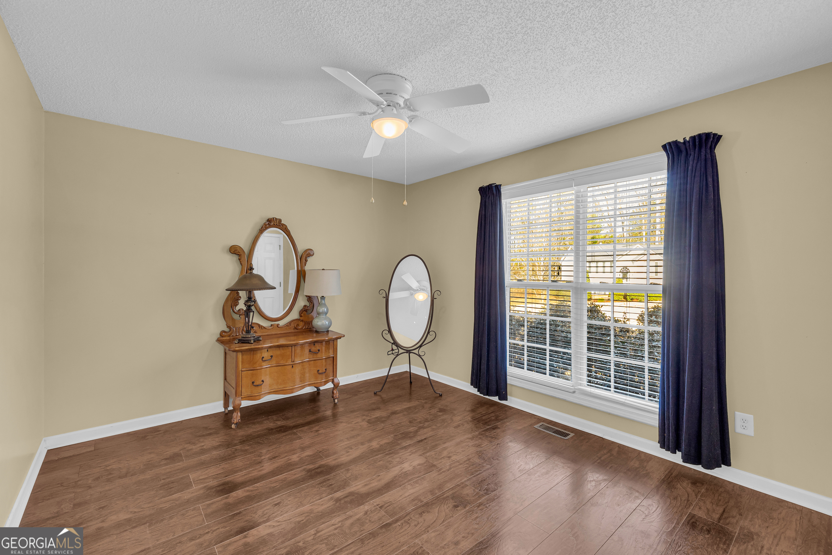 139 Silverstone Circle Jefferson, GA 30549 - Photo 64 of 85 a view of a livingroom with furniture wooden floor and window