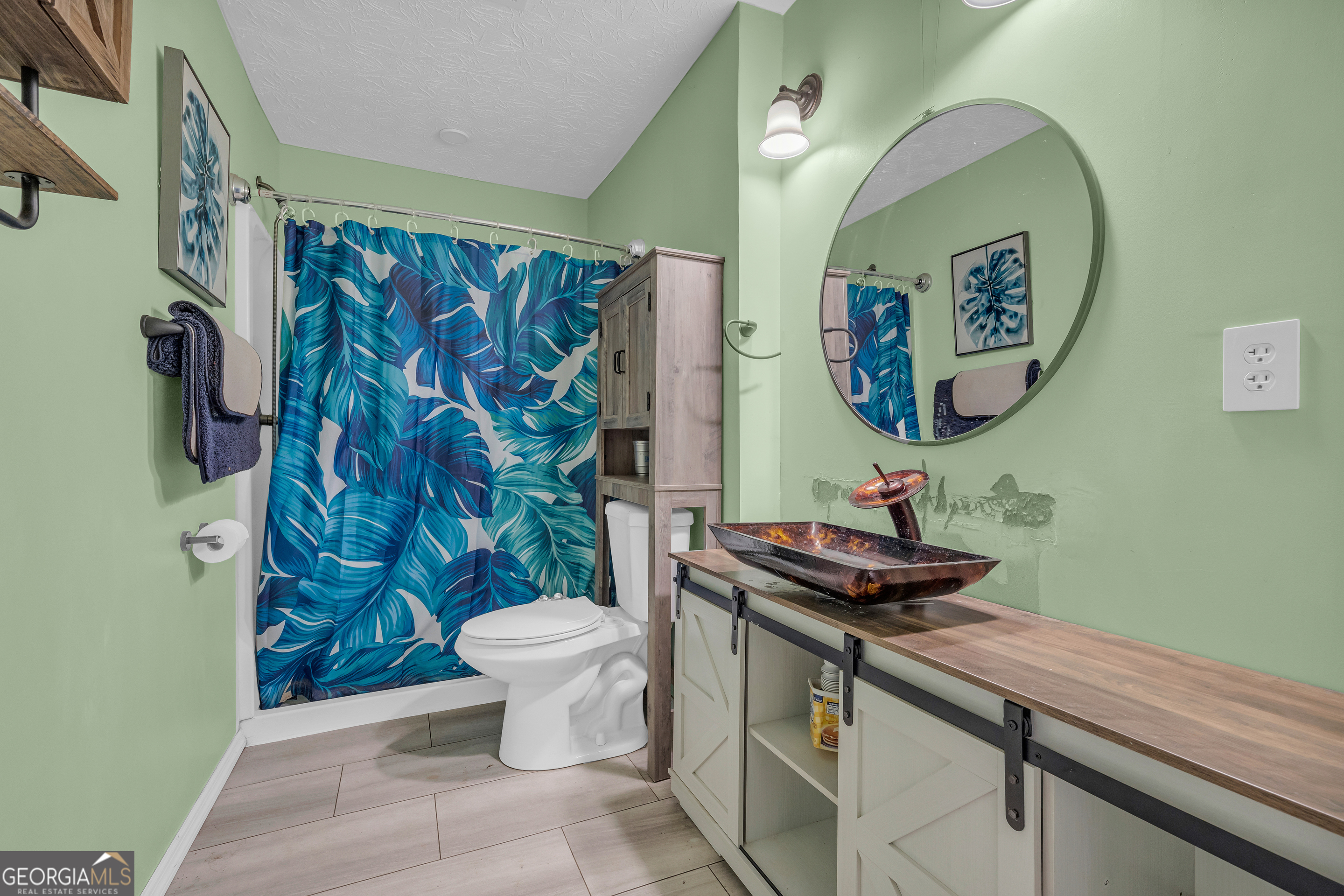 139 Silverstone Circle Jefferson, GA 30549 - Photo 79 of 85 a bathroom with a granite countertop sink a toilet and a mirror
